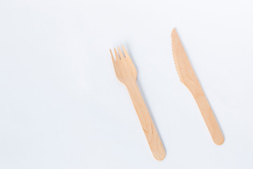 Eco friendly materials,Wooden disposable tableware isolated on a white background.