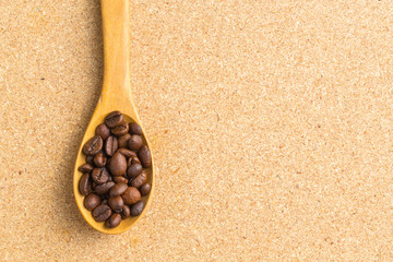Coffee beans in the spoon wooden