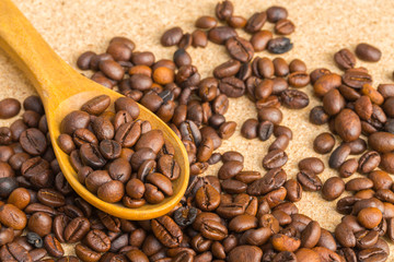 Coffee beans in the spoon wooden