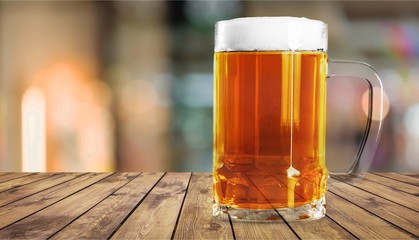 Mugs of cold beer with foam, close-up view