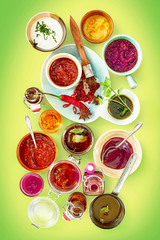 Assortment of spices and sauces inside bowls