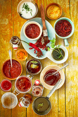 Sauces and spices with herb ingredients on top