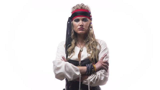 Blonde female pirate in old clothes is standing on white background, 4k