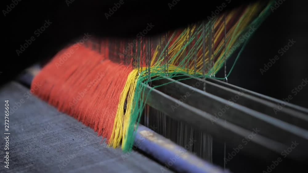 Poster close up weaver operating handloom