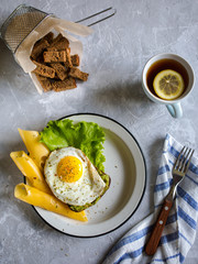 fried eggs with cheese and bread. Breakfast