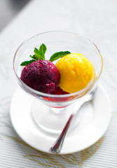 Colorful cool ice cream in glass dish. Food, sugar dessert concept