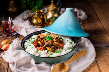 Tajin beef stew with rice paprika and sesame seeds