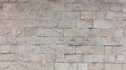 Decorative bricks on the wall of the house as a background