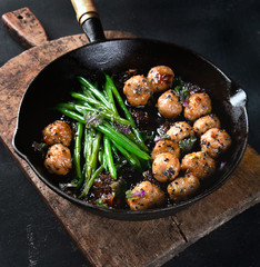 Meatballs, green beans sauce  with sesame and soy sauce