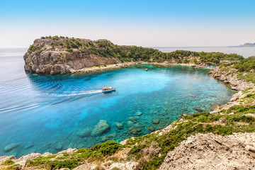 Popular tourist attraction on Rhodes island - azure lagoon known as Anthony Quinn Bay. Sea travel...