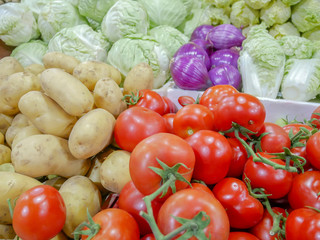 Tomato vegetables, carrots, potatoes, background, fresh vegetables in the market