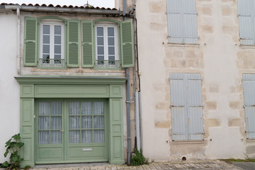 village on Isle de Re Saint Martin de Re village France with old house and green grey shutter