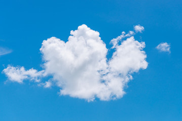 Naklejka na ściany i meble Cloud in shape of heart on blue sky