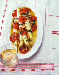 Asparagus with baked tomatoes on a plate