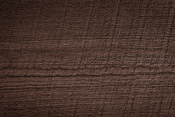 Texture of dark brown old rough wood. Abstract background for design. Vintage retro