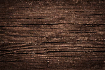 Texture of dark brown old rough wood. Abstract background for design. Vintage retro
