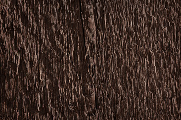 Texture of dark brown old rough wood. Abstract background for design. Vintage retro