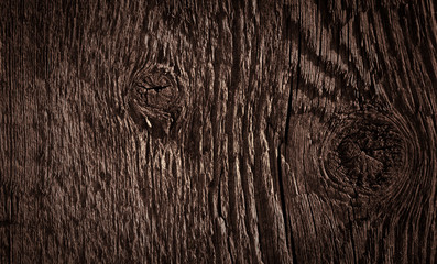 Texture of dark brown old rough wood. Abstract background for design. Vintage retro