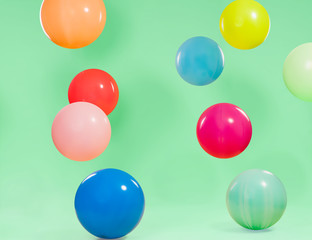 Beautiful colorful balloons with green background