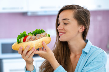 Hungry eating woman eat homemade sandwich. Food addiction. Enjoying food