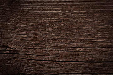 Texture of dark brown old rough wood. Abstract background for design. Vintage retro
