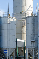 industrial architecture with storage silos, in an industry that produces cement.roduces cement.