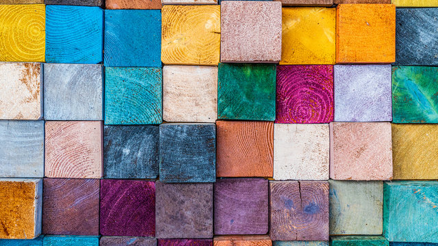 Wood texture block stack on the wall for background, Abstract colorful wood texture. © Kalyakan