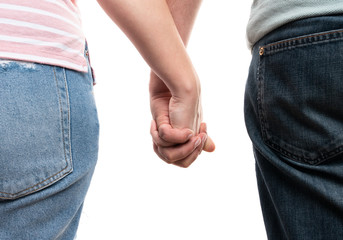 Closeup of couple holding hands