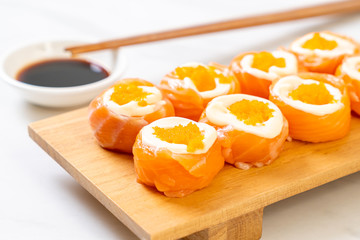 fresh salmon sushi roll with mayonnaise and shrimp egg