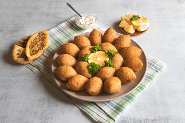 Traditional Arabic kibbeh with lamb and pine nuts.