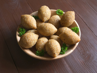 Traditional Arabic kibbeh with lamb and pine nuts.