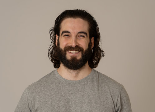 Portrait of attractive cheerful young man with smiling happy face. Human expressions and emotions