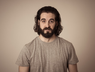 Obraz premium Portrait of sensitive hipster man suffering from depression. Human expressions and emotions