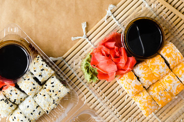 Fresh and delicious maki and nigiri sushi. sushi set in the plastic box. Delivery concept
