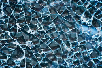 Broken tempered glass closeup. Broken window