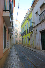narrow alley in the old town alfama in lisbon, portugal