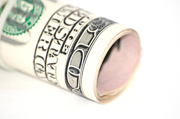 Money on white background close up of dollars rolled up