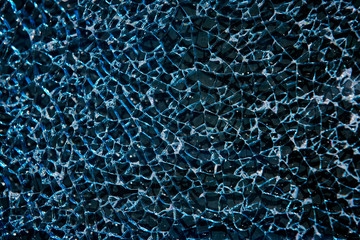 Broken tempered glass closeup. Broken window