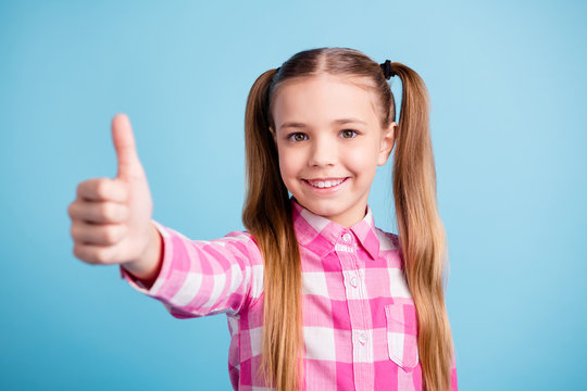 Close up photo beautiful amazing she her little lady thumb finger up tips promo advising test school best student vacation mood wear casual checkered plaid pink shirt isolated bright blue background