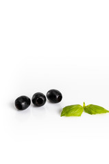Black olives composition on a white background.