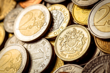 Background of Euro coins money.United kingdom Pound coin.US coins.Group of coins