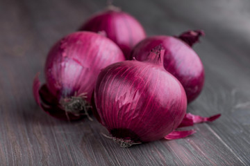 red onions on rustic wood