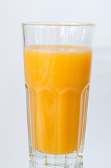 Orange juice glass, isolated on white background, vertical format