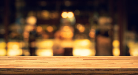 Wood texture table top (counter bar) with blur light gold bokeh in cafe,restaurant background
