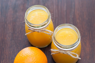 Orange juice in cans rustic style top view, flat lay