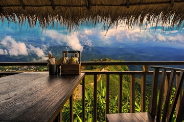 The wood table set in the restaurant,good emotion and beautiful cliff view. © Rangsan
