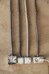 Electrical wiring on gray wall