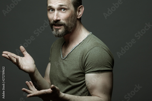 Fabulous At Any Age Portrait Of 40 Year Old Man Talking Over Dark