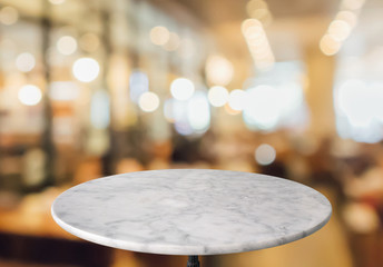 round marble table top with cafe restaurant bokeh lights abstract background for montage product...