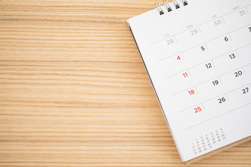 calendar page on wood table background